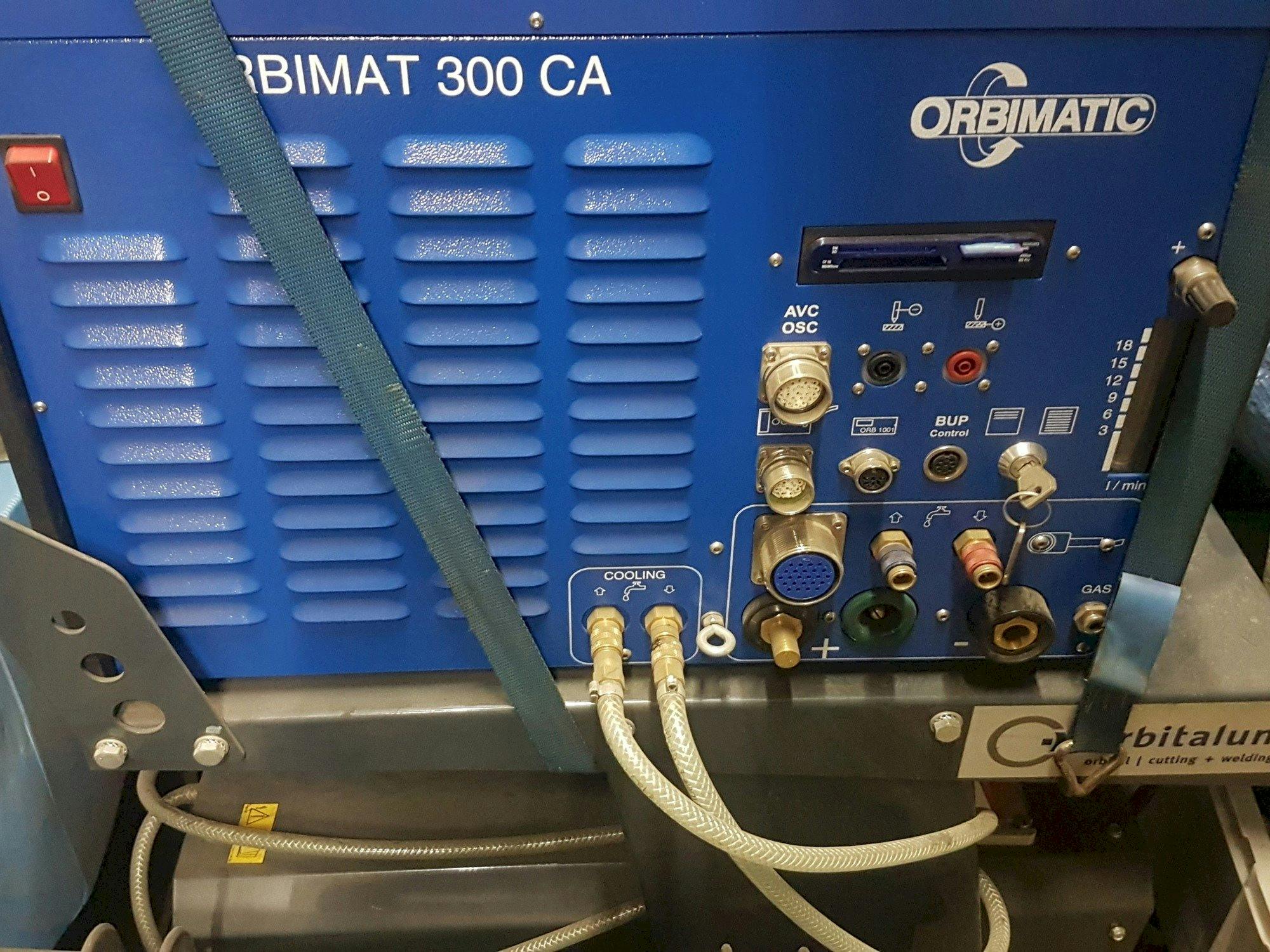 Vista frontale della macchina Orbitalum ORBIMAT 300 CA AVC/OSC