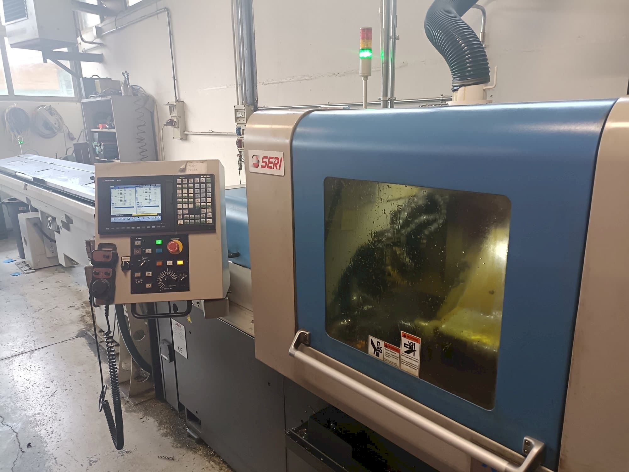 Vista frontale della macchina NOMURA