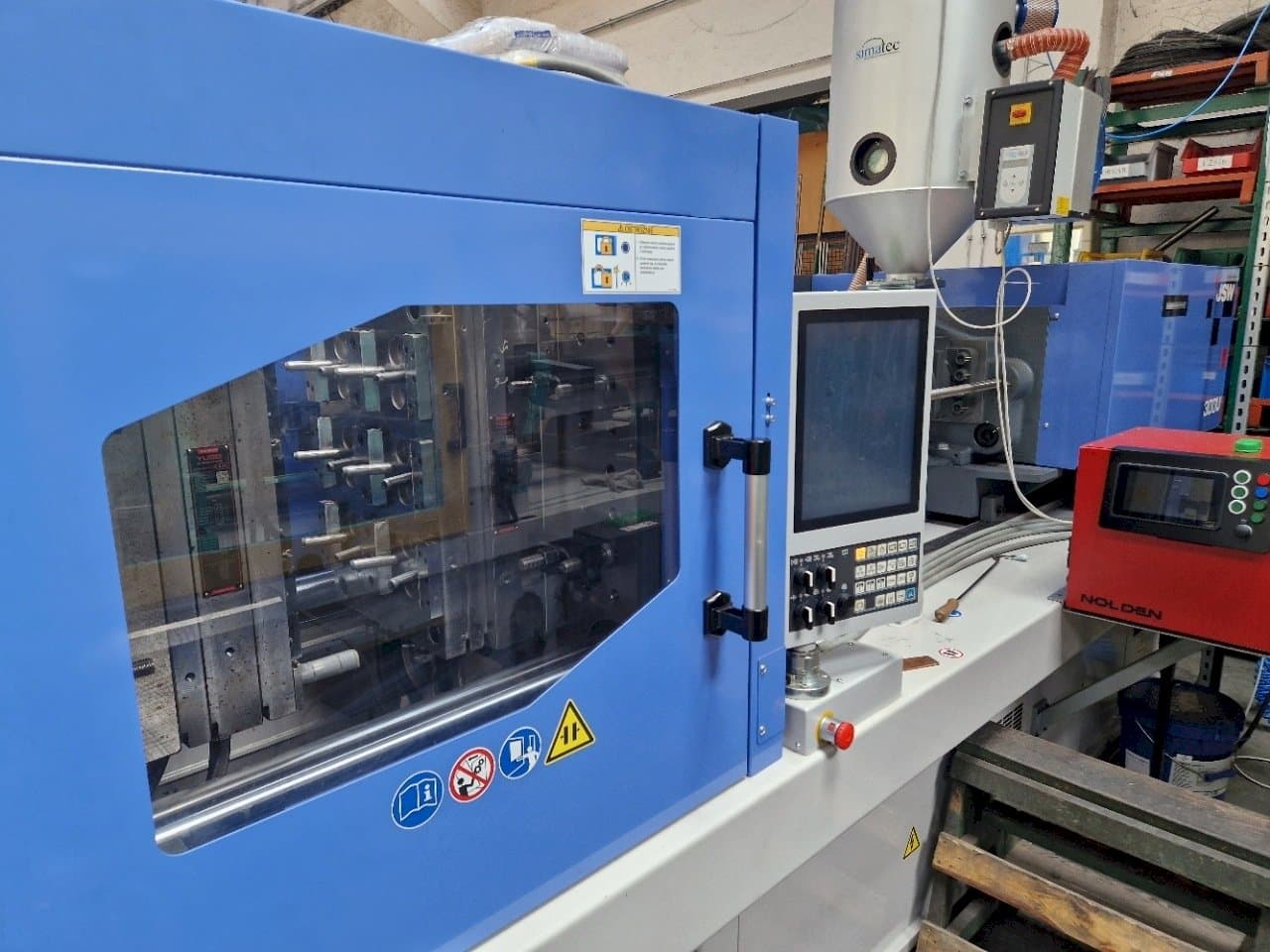 Vista laterale sinistra della macchina JSW J180ADS-300U