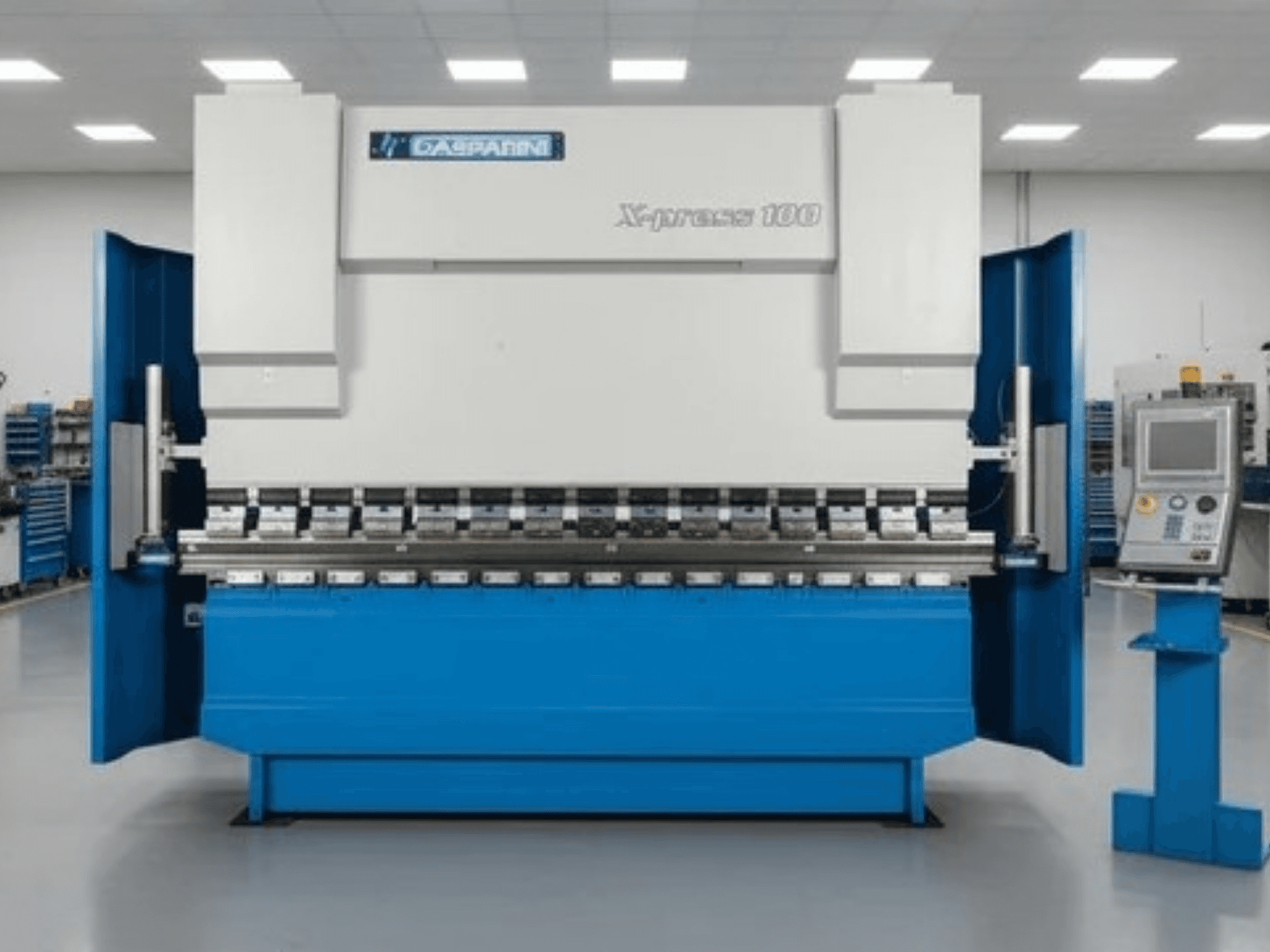 Pressa idraulica GASPARINI X-Press 100, vista frontale, con carrozzeria blu e pannello di comando sul lato destro.
