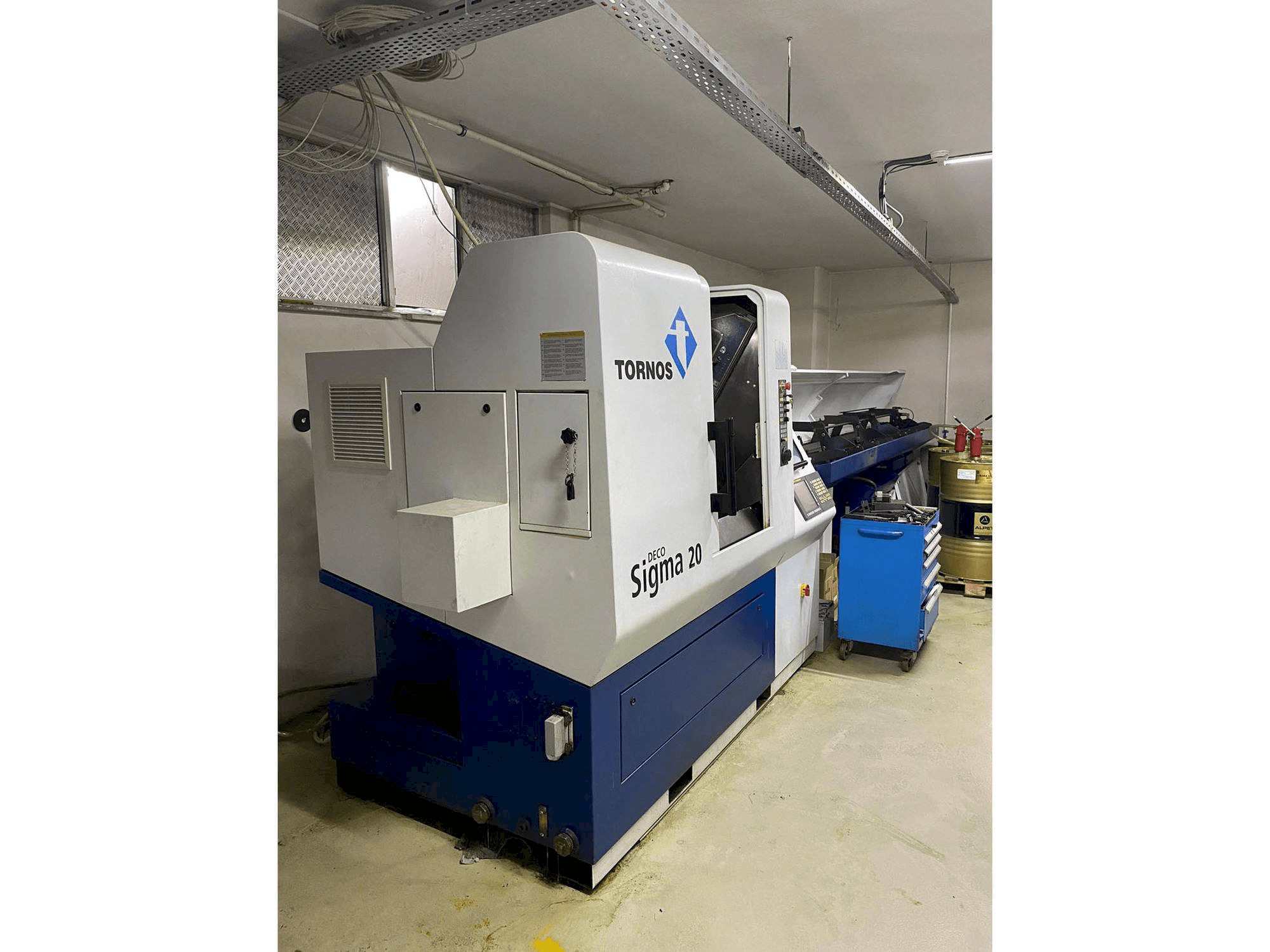 Vista laterale sinistra della macchina Tornos Delta Sigma 20