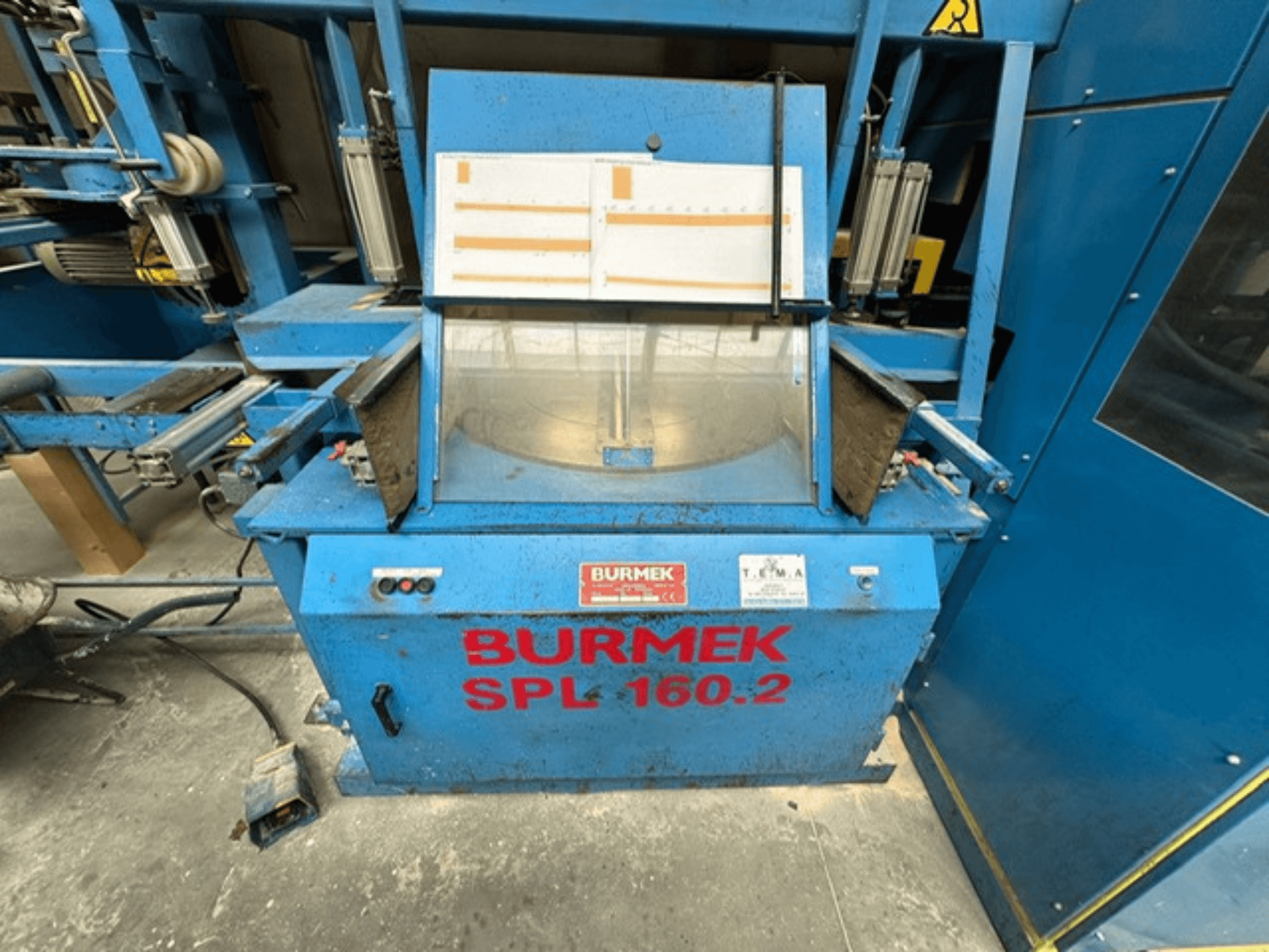 Macchina per il legno BURMEK SPL 160.2 blu, vista frontale, con pulsanti di controllo e un pannello di vetro che mostra l'interno.