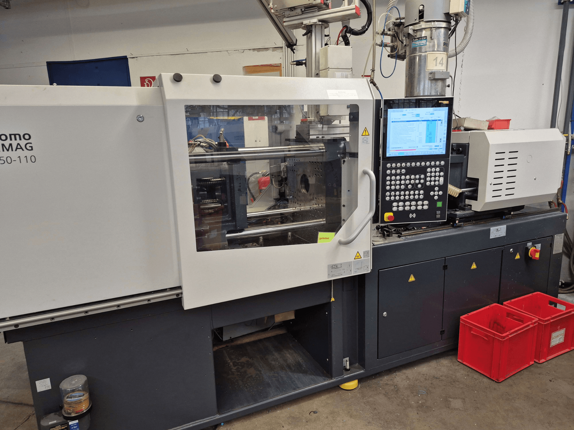 Macchina per lo stampaggio a iniezione elettrica SUMITOMO SHI DEMAG Intelect 2 50/360-110, vista laterale con pannello di controllo e dispositivi di sicurezza visibili.