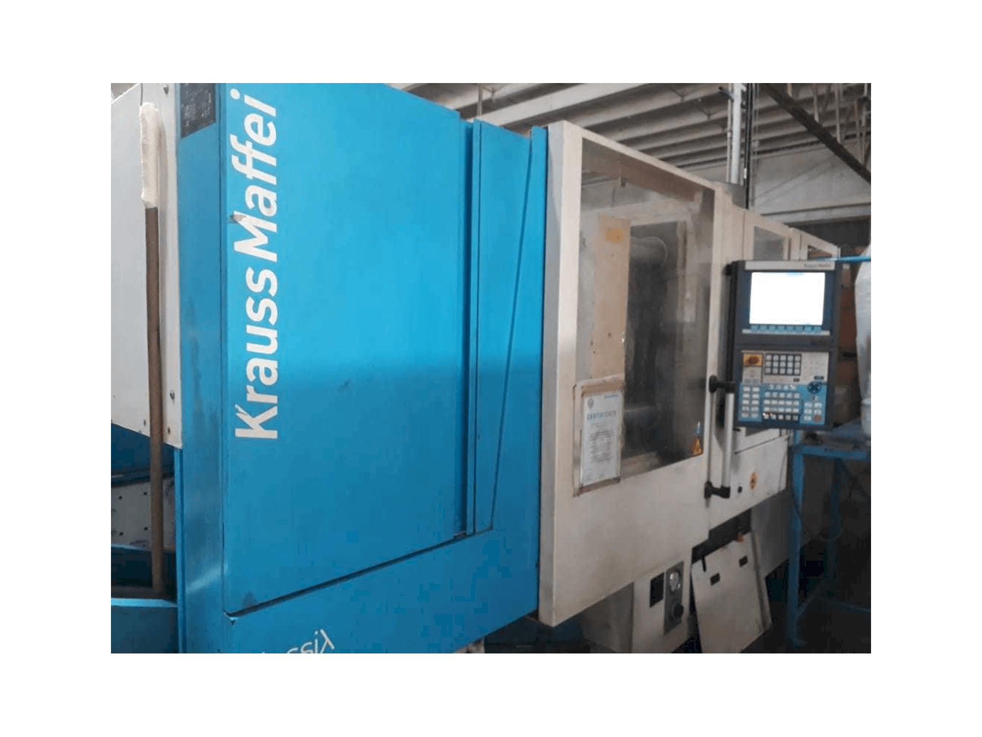 Vista frontale della macchina Krauss Maffei 160/750 CX