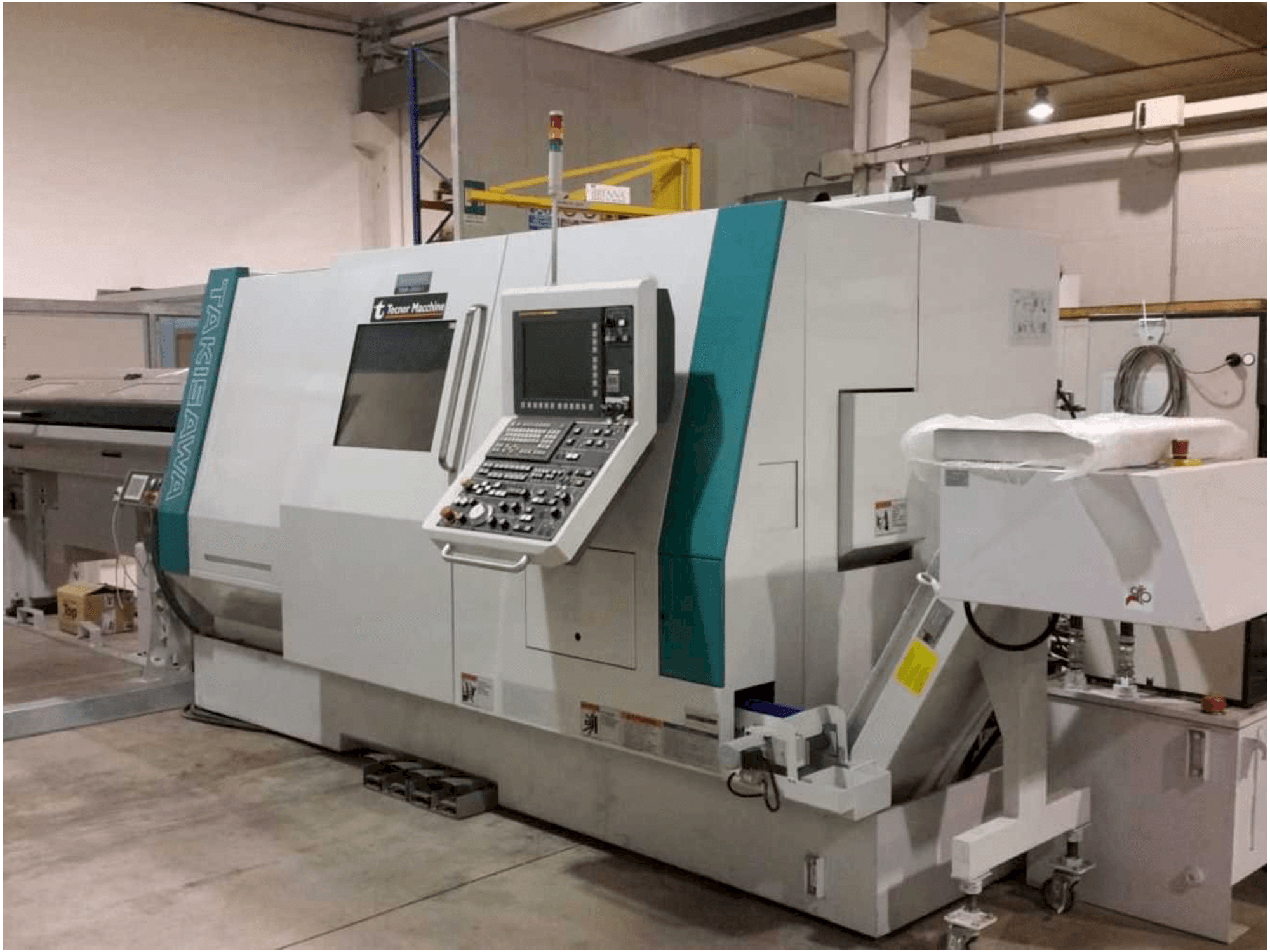 Vista frontale della macchina Takisawa TMMY-250 M1
