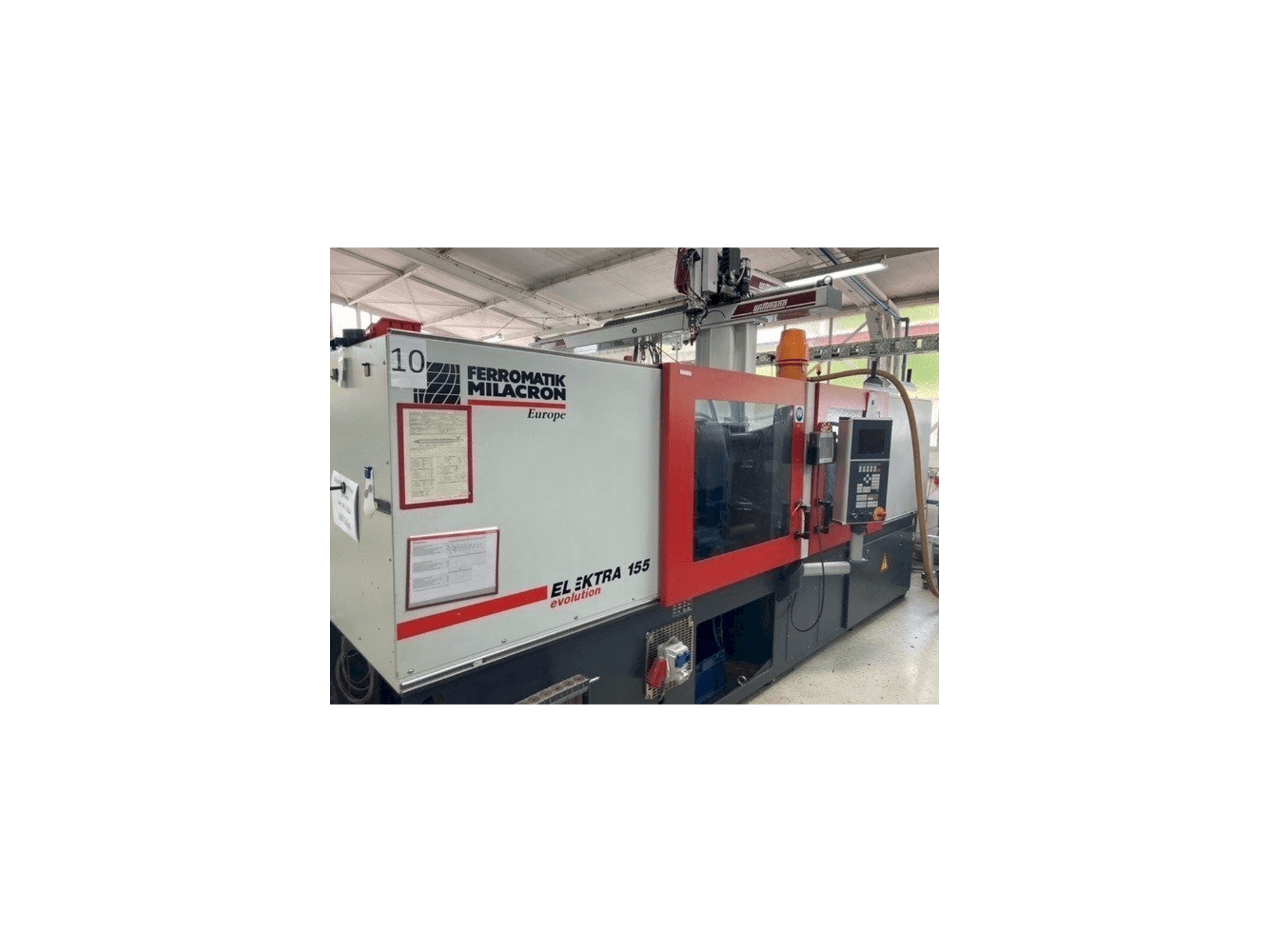 Vista frontale della macchina FERROMATIK MILACRON EE 155