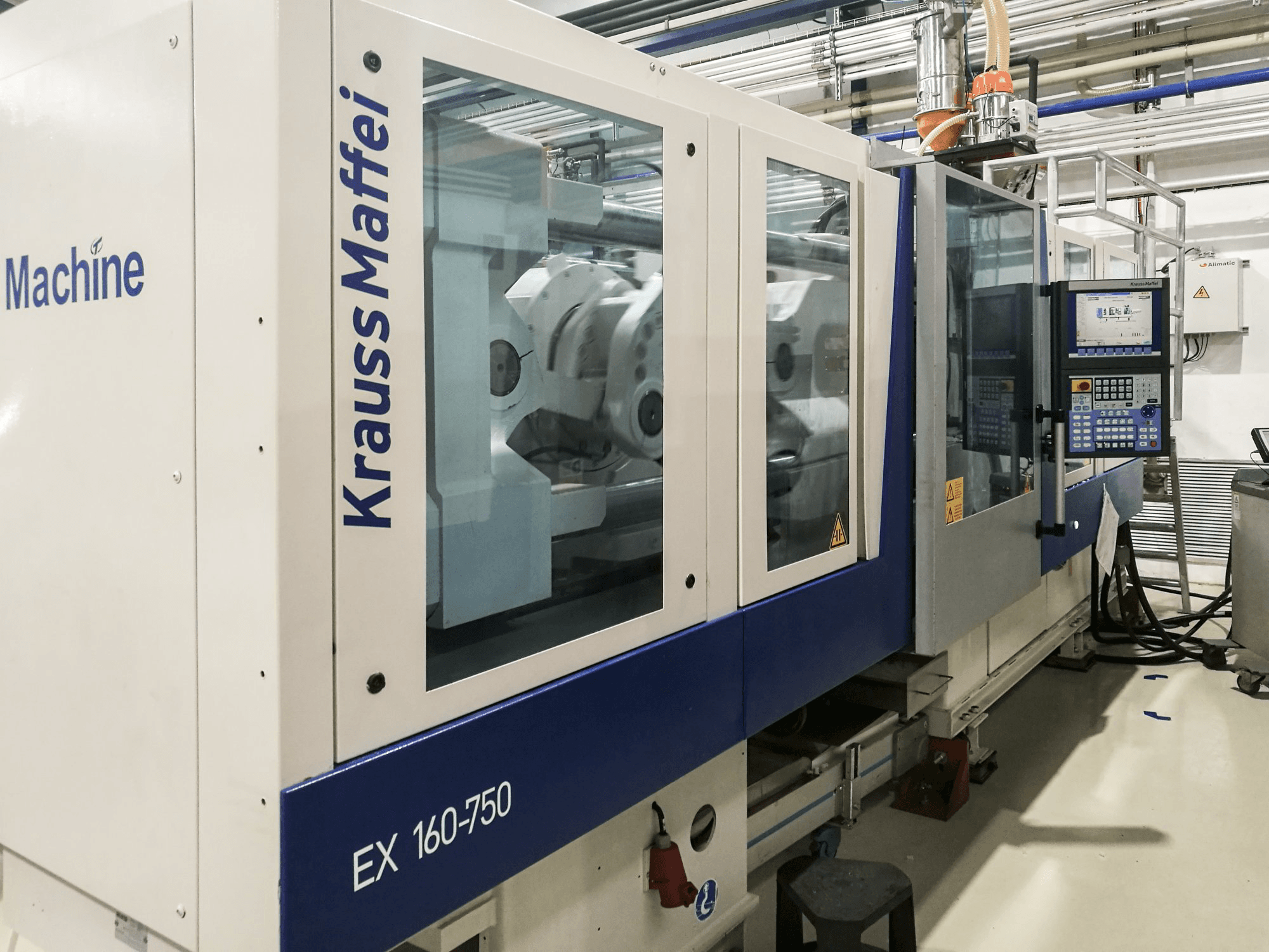 Vista lato sinistro della macchina Krauss Maffei 160-750 EX