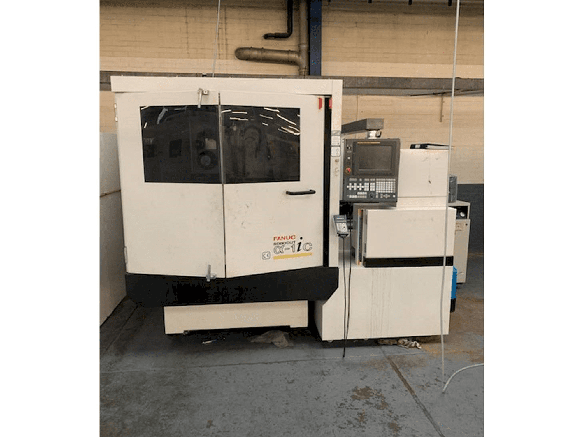 Vista frontale della macchina FANUC ROBOCUT Alpha -1iC S Axis