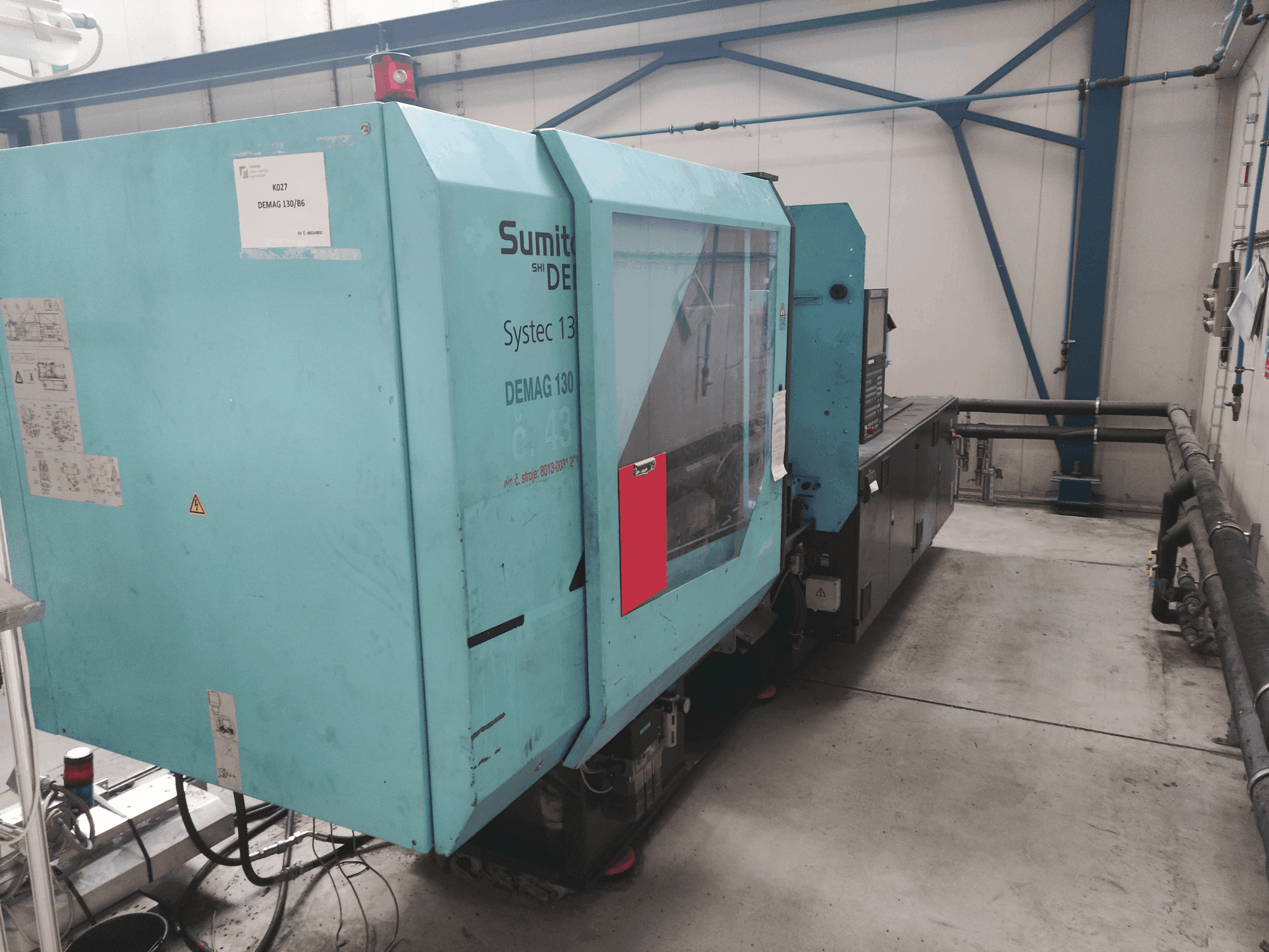 Vista frontale della macchina DEMAG Systec 130/475-430