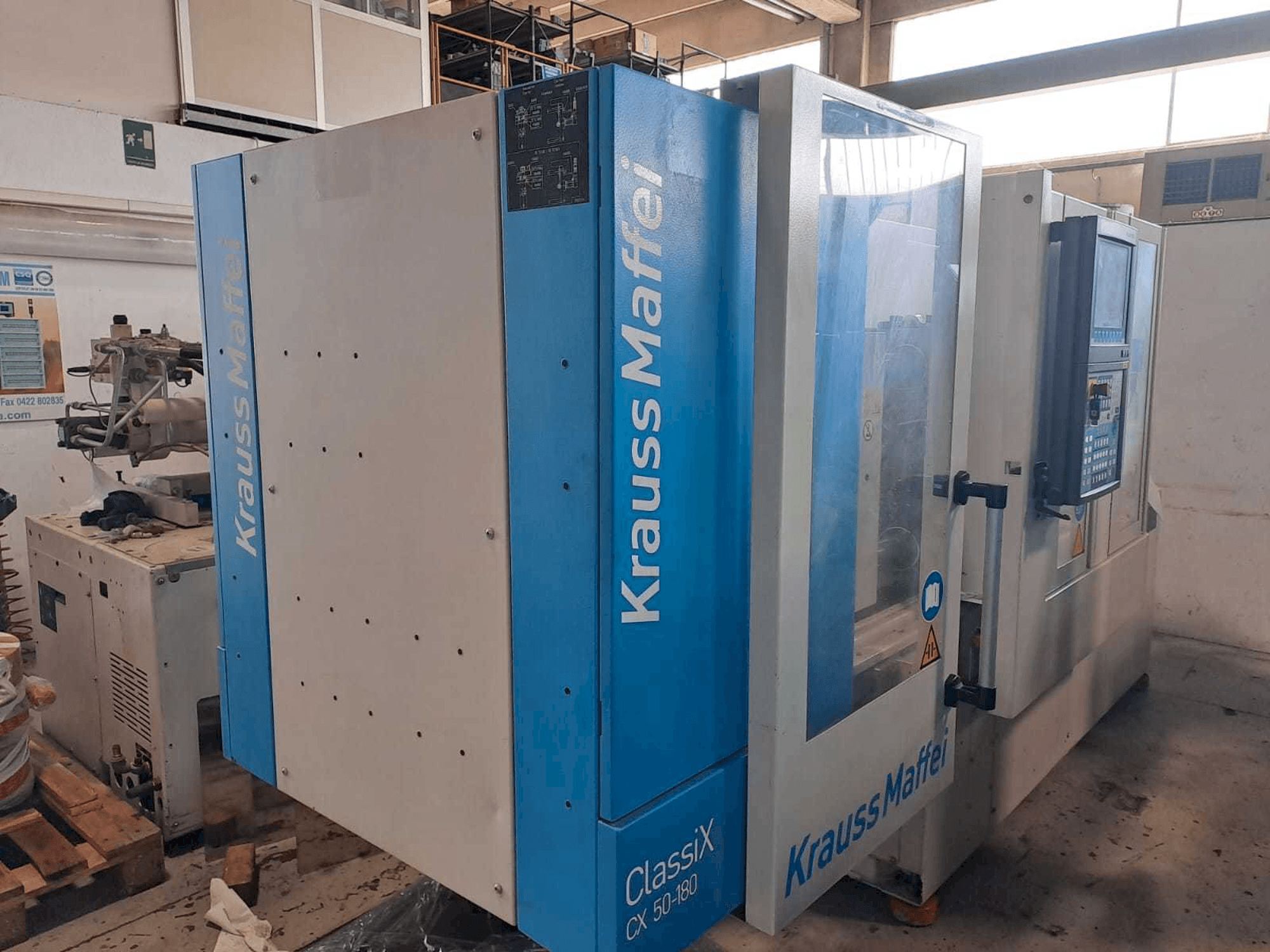 Vista lato sinistro della macchina Krauss Maffei 50-180CX