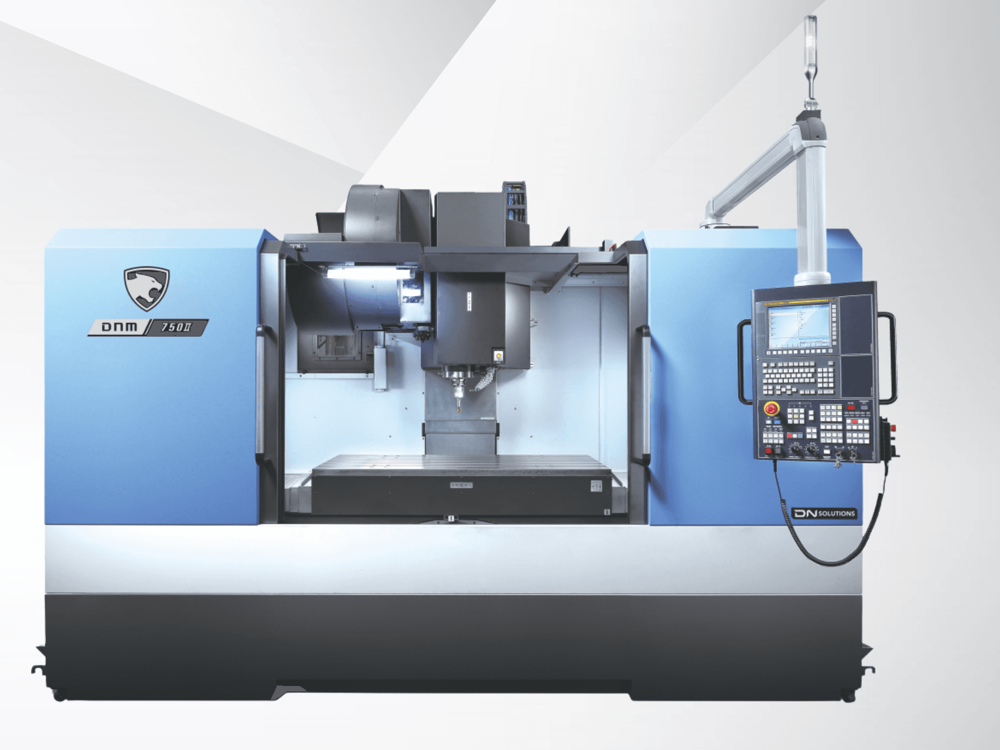 Centro di lavorazione verticale DN SOLUTIONS DNM 750 II, vista frontale, con pannello di controllo e area di lavoro aperta.