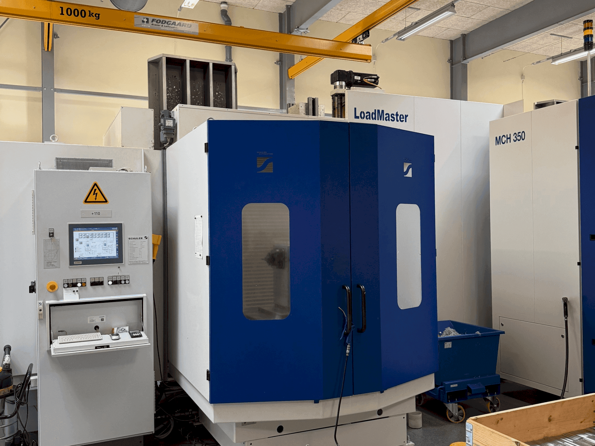 Vista frontale della macchina HELLER MCH 300 + MCH 300 C + 22 pallet system